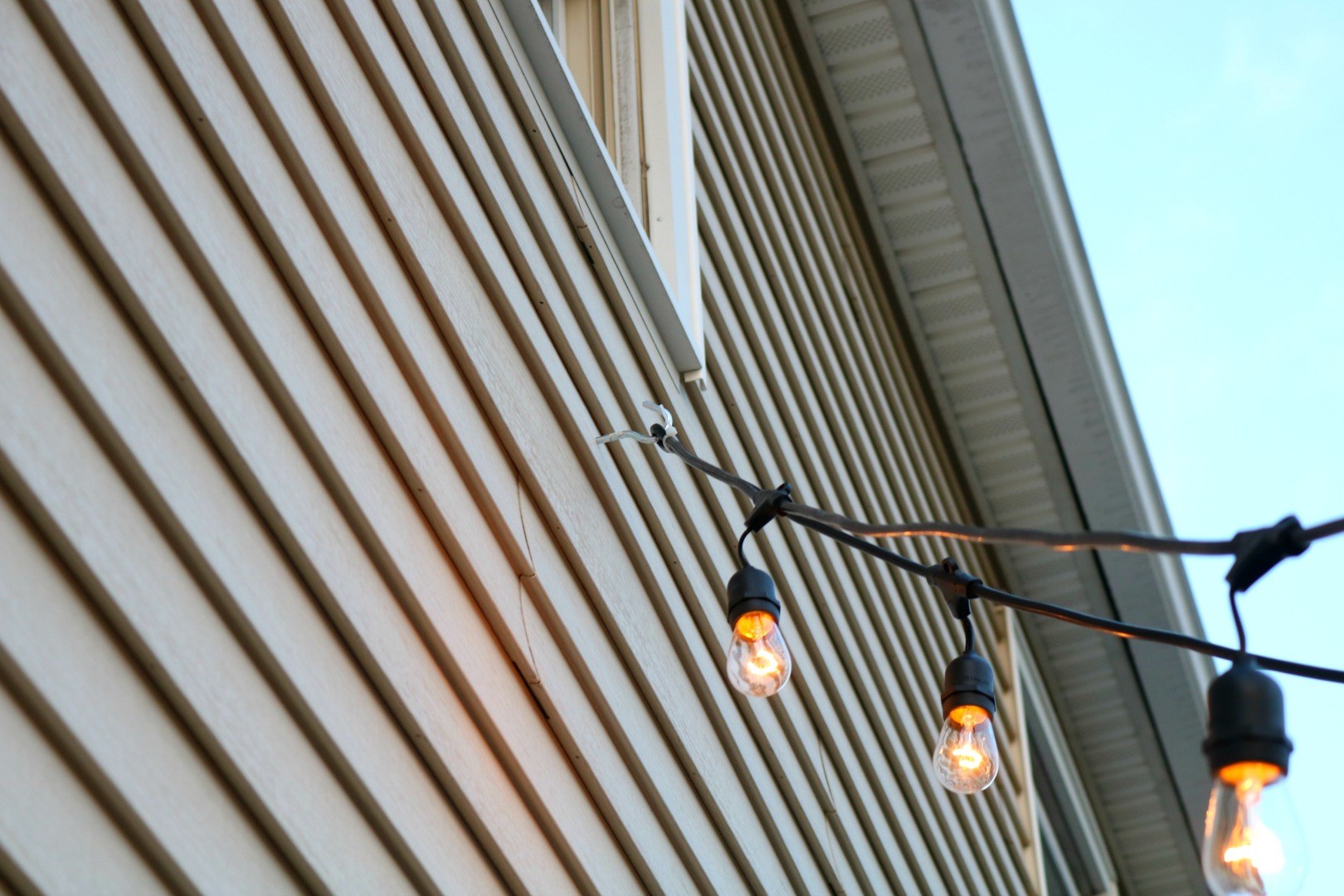 How We Hung Our Deck String Lights, How To Hang Patio Lights On Brick Wall